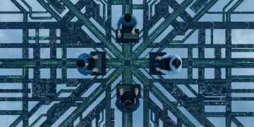 Smart Spending: Uncovering the Latest Budget Gaming Peripherals Aerial view of a stylized circuit board landscape with people interacting with miniaturized budget gaming peripherals, symbolizing widespread accessibility.
